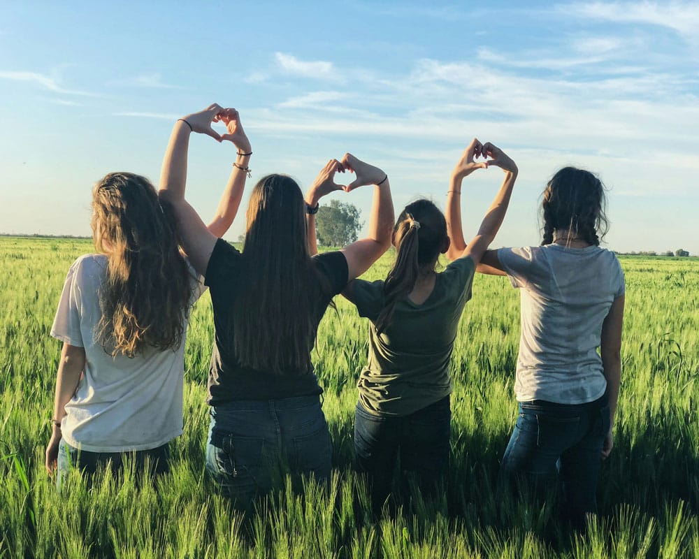 girls-standing-in-a-field-v2 girls-standing-in-a-field-v2